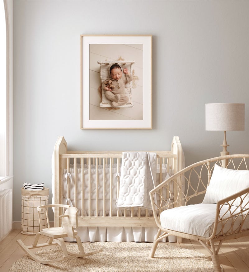 Newborn Photographer, a nursery is decorated with boho style furniture and crib in anticipation of baby